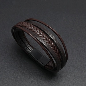 Macro view of multi-layer dark brown braided leather men's bracelet with matte magnetic clasp