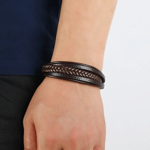 Men's multi-layer braided brown leather bracelet with magnetic clasp on wrist