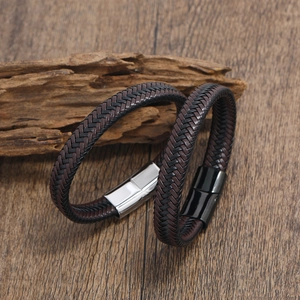 Men's braided leather bracelets with stainless steel magnetic clasps on wood background