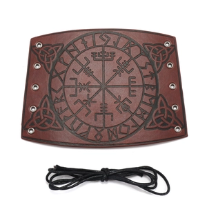 Detail of brown Viking leather bracer with embossed Vegvisir compass and lacing eyelets