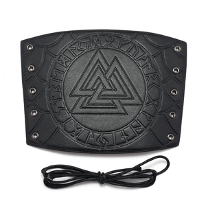 Detail of Valknut and Runes embossed on a black faux leather Viking bracer