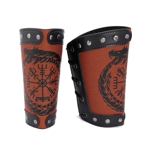 Brown Viking leather gauntlets with Norse Vegvisir compass and dragon rivets on white background