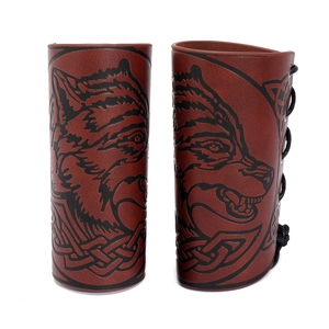 Detail of brown PU leather wrist guards with black wolf head and lace-up closure