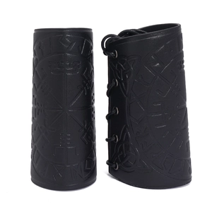 Detail of black faux leather arm guards with embossed Viking compass and adjustable laces