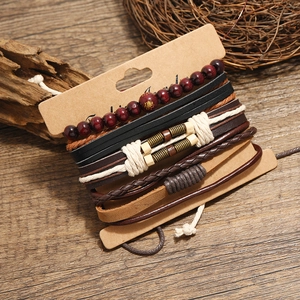 Men's retro multilayer leather bracelet set with wooden beads and woven cords on wood background