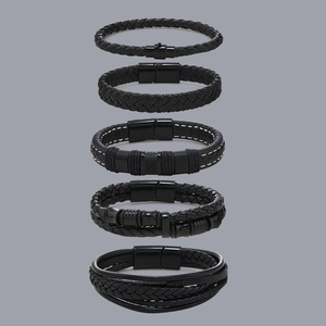 Detail of five-piece black braided leather bracelet set for men with magnetic metal clasps