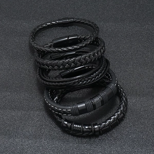 Detailed view of 5-piece men's black braided leather bracelet set with magnetic clasps