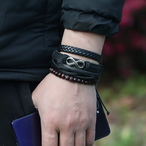 Men's vintage layered bracelet set with infinity charm, woven leather, and wooden beads