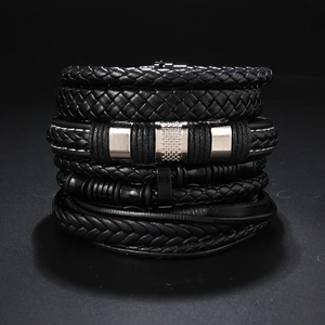 Detail of multi-layer men's braided leather bracelet with silver textured metal tubes