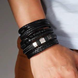 Close-up of men's multilayer braided leather bracelet set with magnetic metal clasp