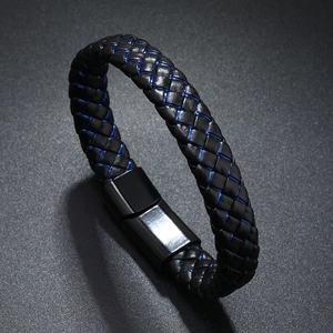 Detail of men's braided black leather bracelet featuring blue contrast stitching and magnetic clasp