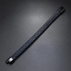 Detail of men's black braided leather bracelet with blue stitching and matte metal buckle