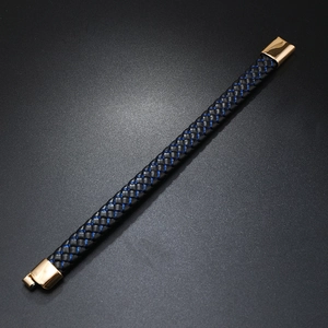 Detail of a braided leather bracelet with high-quality gold magnetic metal clasp