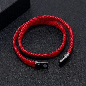 Detail of red multilayer braided leather bracelet with black magnetic clasp