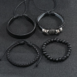 Detail view of 4-piece set including woven leather bracelets and black beaded wristbands