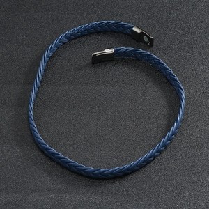 Detail view of deep blue braided leather bracelet with dark gunmetal magnetic clasp buckle