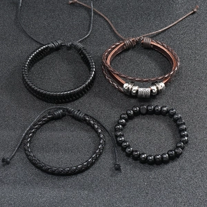 Detail view of 4-piece set vintage multilayer leather braided and beaded men bracelets