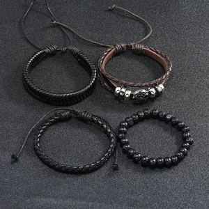 Detail view of 4-piece vintage leather bracelet set with woven straps and beads