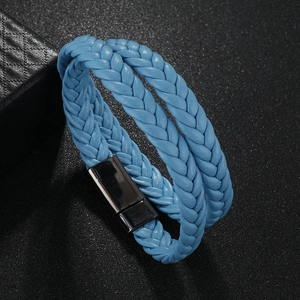 Close-up of double-layer blue braided leather bracelet with a sleek black magnetic clasp