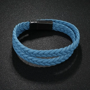 Close-up of blue braided leather bracelet with a sleek black magnetic metal clasp