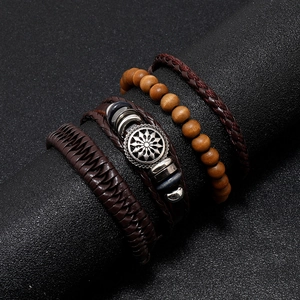Retro 4-piece men's leather bracelet set with woven straps and metal flower charms
