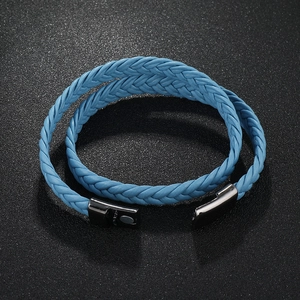 Detailed view of sky blue braided leather double-wrap bracelet with gunmetal magnetic clasp