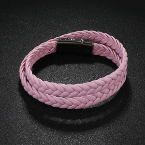 Detail of pink double-strand braided leather bracelet with black magnetic clasp