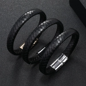 Three-piece set of woven leather bracelets for men with gold, black, and silver magnetic clasps