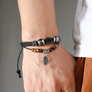 Men's layered woven leather bracelet with wooden beads and silver leaf pendant charm