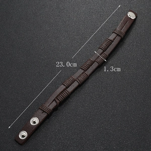 Detail showing the 23cm length and 1.3cm width of the braided leather bracelet with clasp