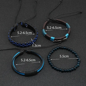 Detail view of 4-piece multilayer leather bracelets with blue beads and braided cord set