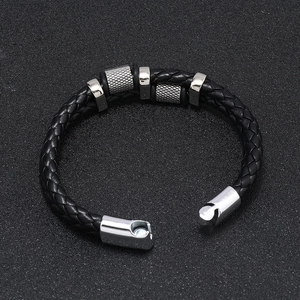 Detail of multi-layer woven black leather bracelet with silver magnetic buckle for men