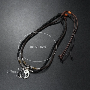 Detail of Yin Yang couples necklaces showing 2.7cm pendants and adjustable cord