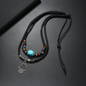 Bohemian Hamsa necklace with turquoise beads and braided cord in retro ethnic style