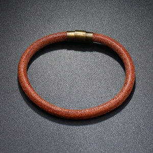 Minimalist dark brown leather cord bracelet with a cylindrical magnetic metal clasp
