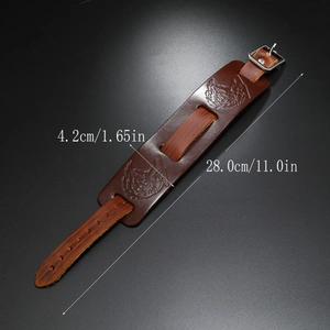 Detail showing the embossed wolf heads on a brown leather punk bracelet with dimensions
