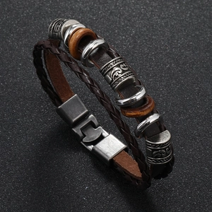 Macro shot showing multi-layer vintage leather strap texture and metallic magnetic clasp