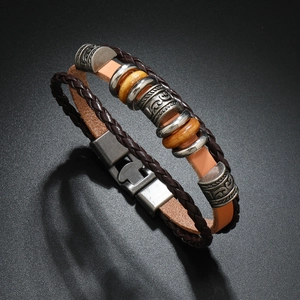Detail of vintage multilayer leather bracelet with metal beads and magnetic clasp