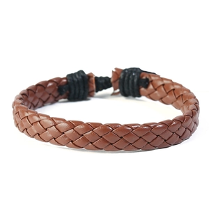 Detailed close-up of retro braided dark brown leather bracelet with black wax cord wrapping