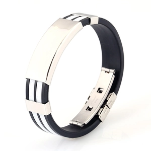 Detailed close-up of men's black silicone sport bracelet with polished stainless steel plate