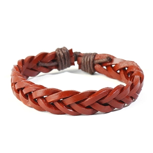 Detailed view of the hand-woven leather textures and adjustable knot on this vintage bracelet
