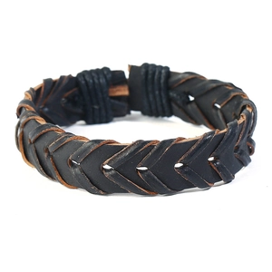 Close-up of black braided leather bracelet featuring vintage arrow pattern weaving