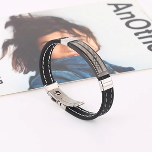 Men's black silicone bracelet with stainless steel plates and secure fold-over clasp