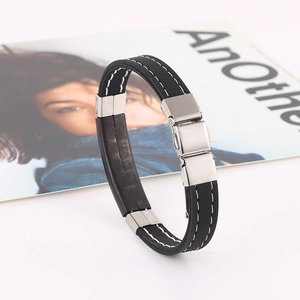Unisex black silicone bracelet with stainless steel accents and white contrast stitching