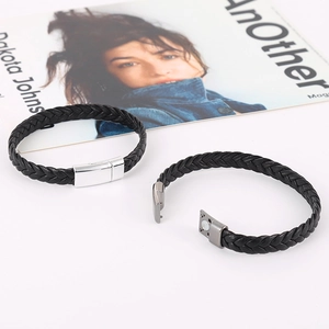 Handmade woven black leather bracelets with metallic magnetic clasps on white background