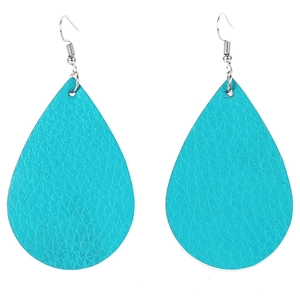 Detailed view of turquoise teardrop earrings with textured faux leather on silver hooks