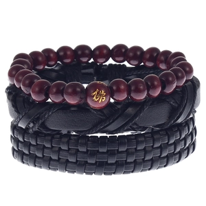 Detail view of men's vintage multi-layer bracelet set with wood beads and braided leather
