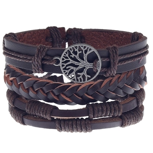 Detail of multi-layer leather bracelet featuring an antique silver Tree of Life charm