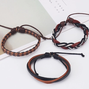 Detailed set of three retro braided leather bracelets with adjustable rope cord closure