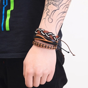 Detail of multi-layer braided leather bracelets for men featuring woven texture and adjustable cords